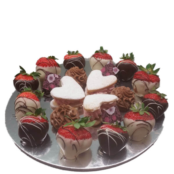 Petit four plate with chocolate dipped strawberries